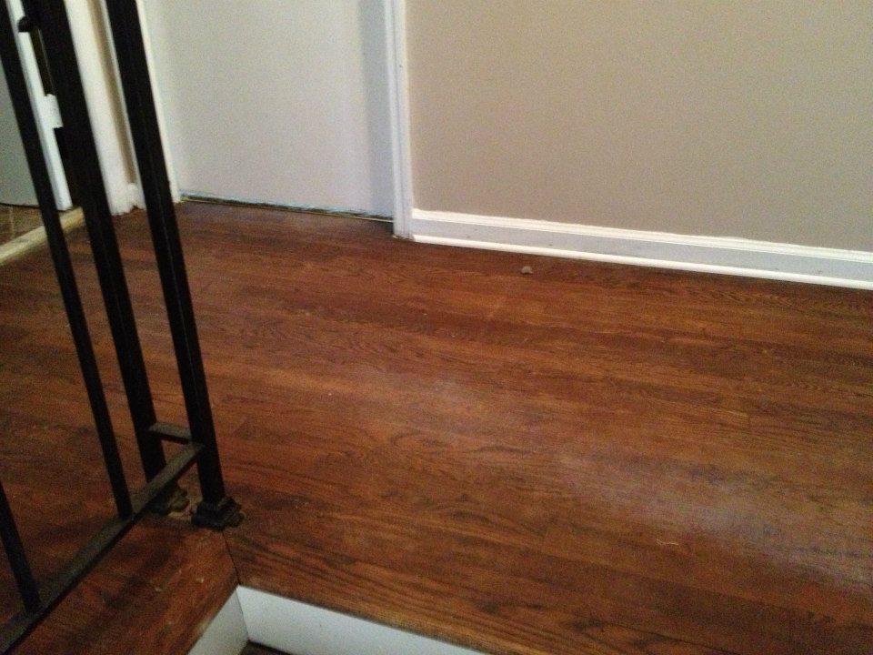 A hardwood floor in need of being refinished